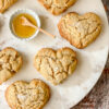 heart shaped corn biscuits with a small dish of honey