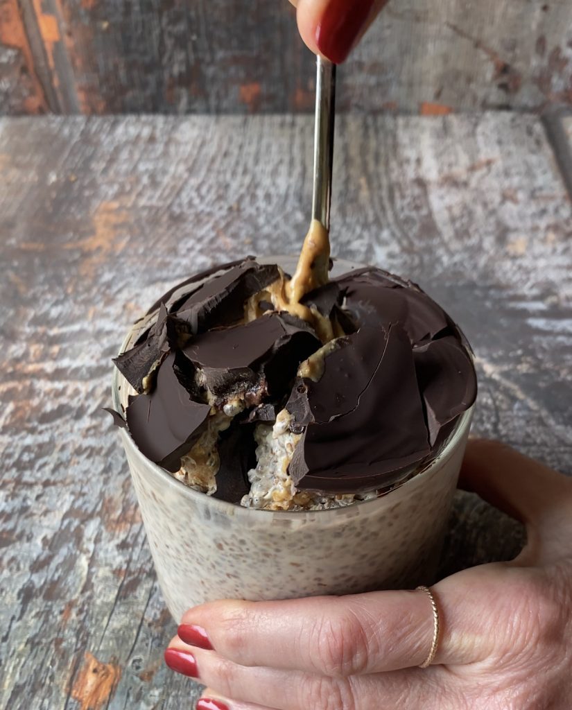 glass jar of peanut butter No Oats with hard dark chocolate magic shell