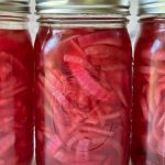 3 jars of vibrant pink pickled red onion
