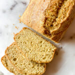 loaf of flax bread with slices of bread