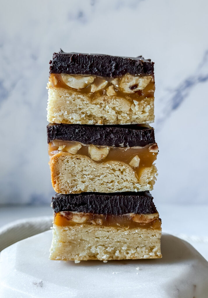 stack of three chocolate caramel shortbread bars