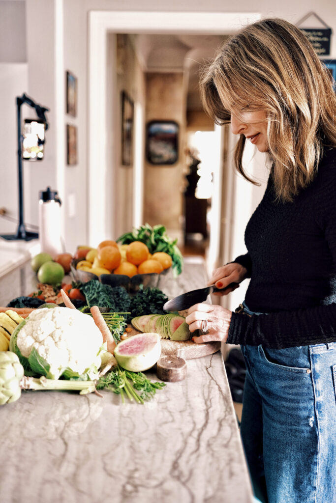 woman preparing food and cutting vegetables