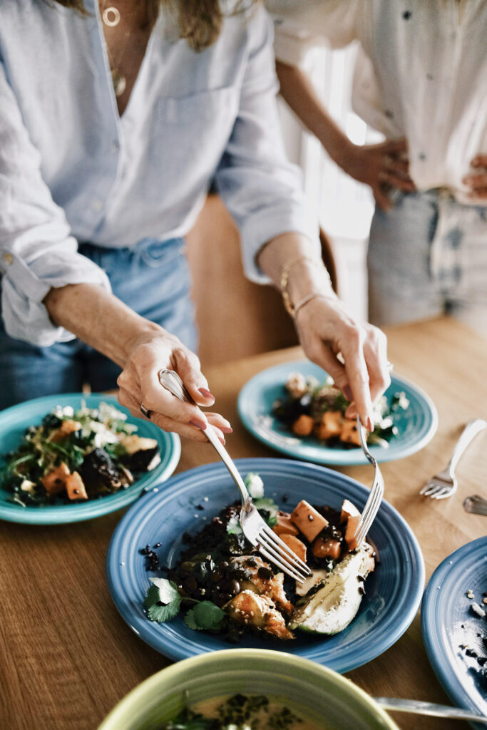 woman's hands serving food