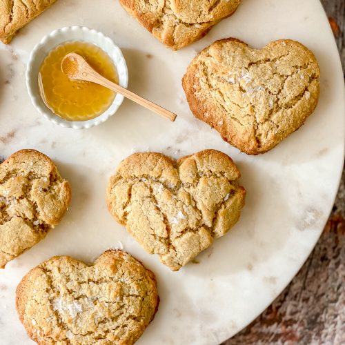 heart shaped corn biscuits with a small dish of honey