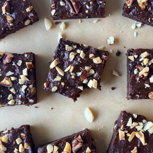 brownies with chopped nuts on top