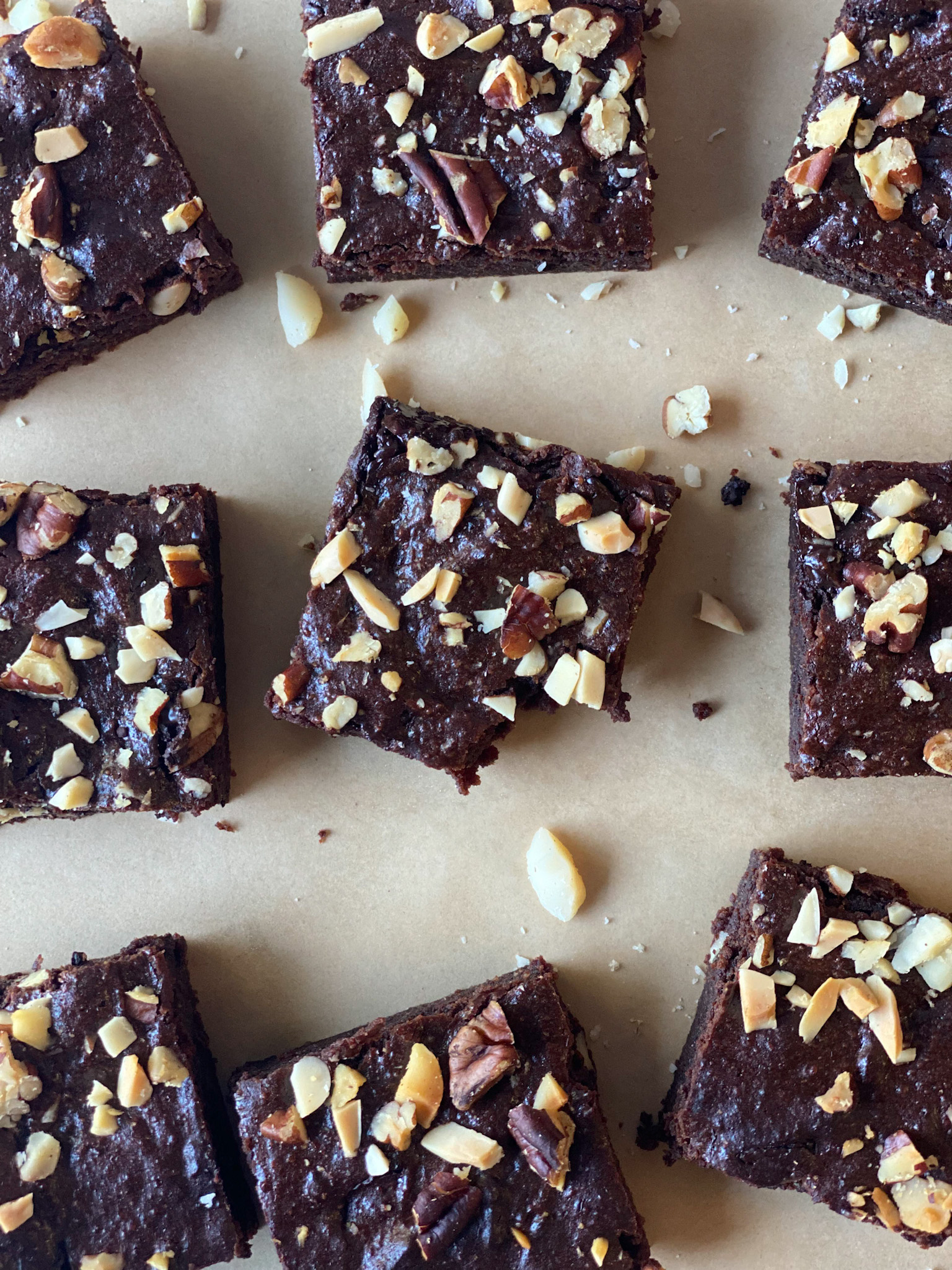 brownies with chopped nuts on top