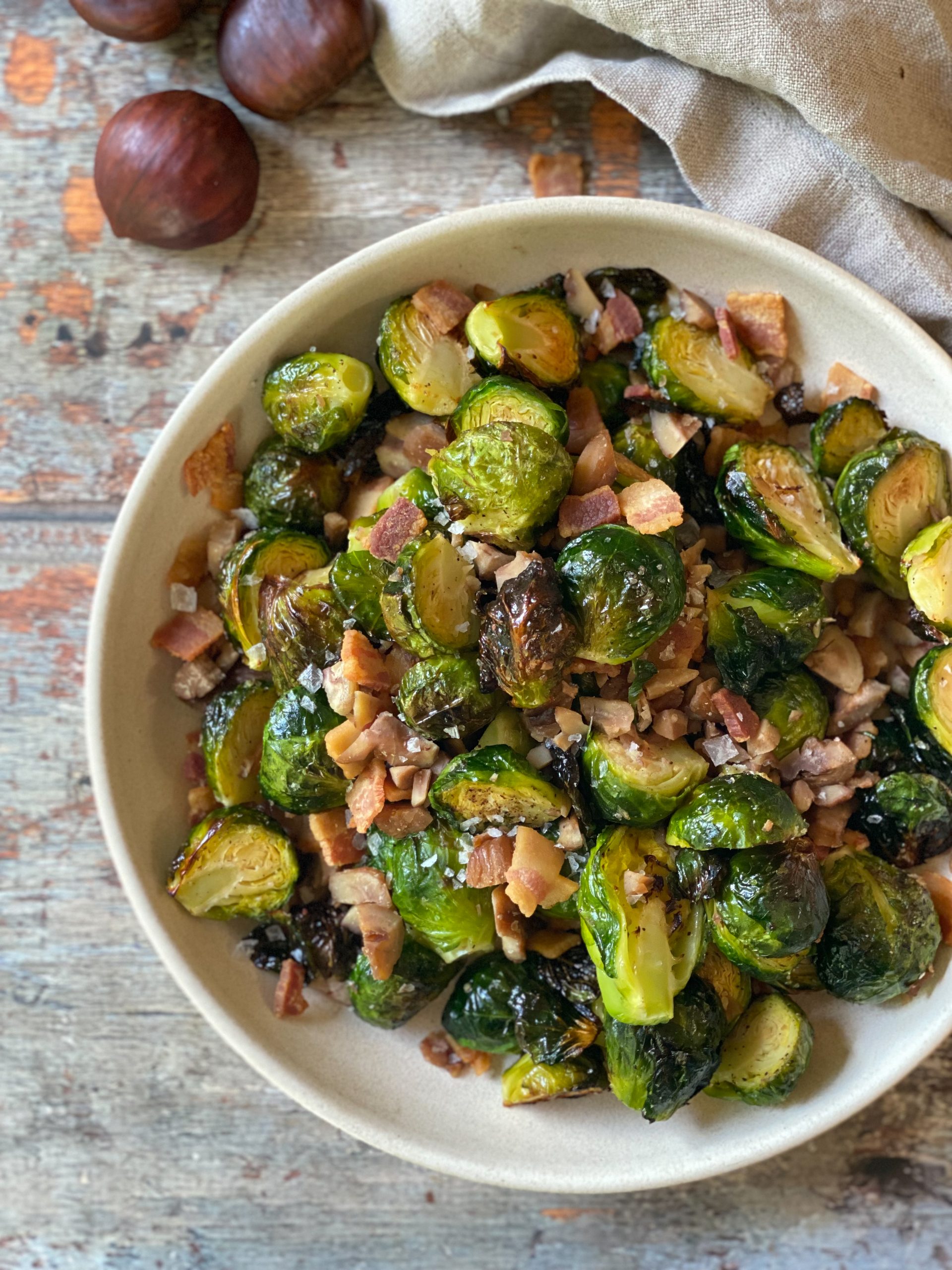 bowl of roasted brussels sprouts with bacon and chestnuts