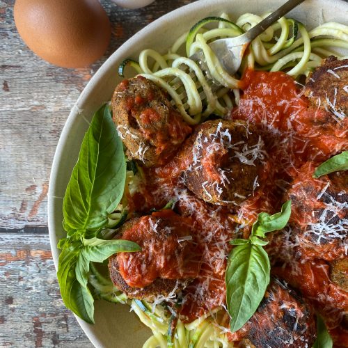 close up of meatless meatballs and zucchini noodles