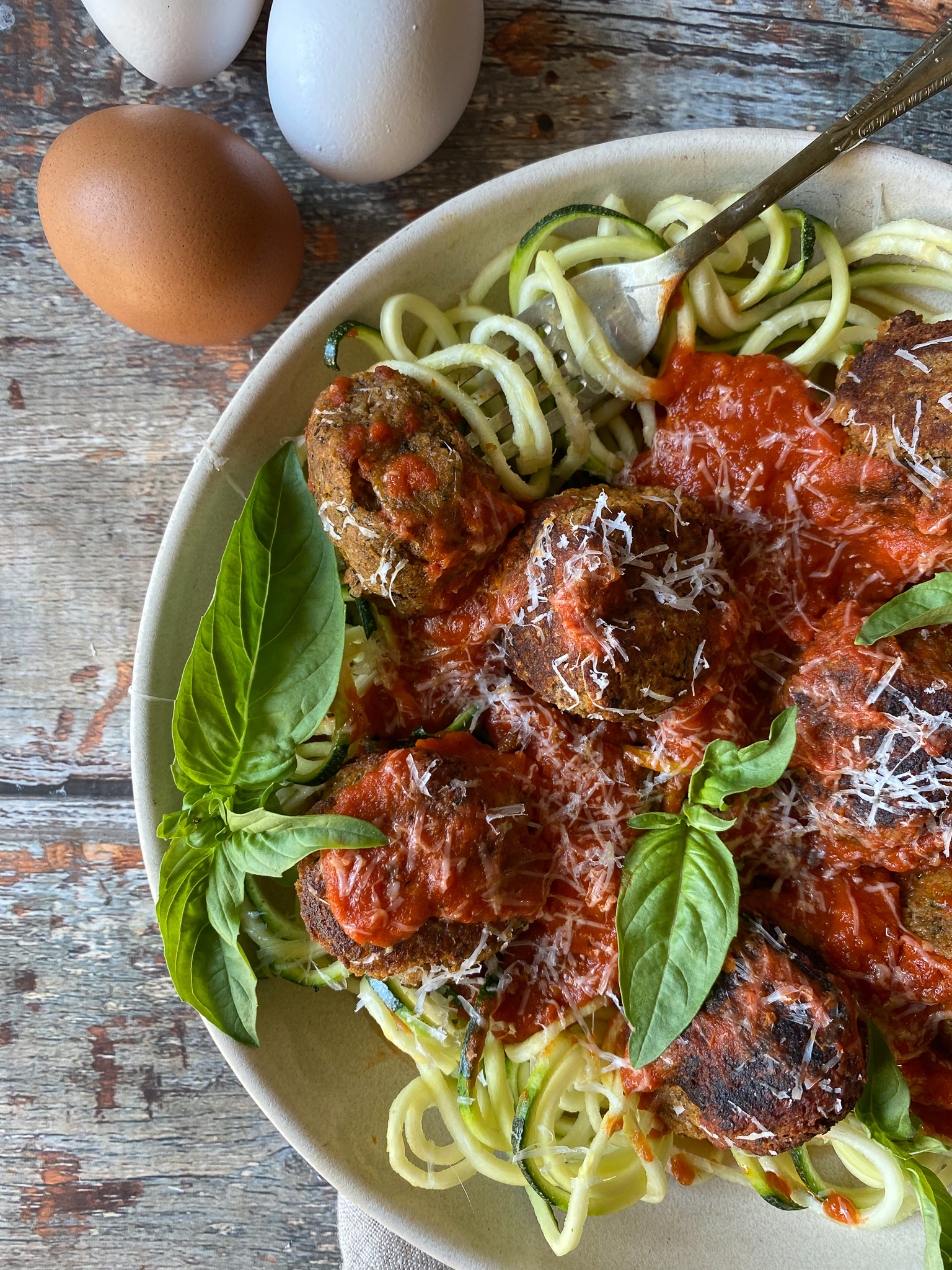 close up of meatless meatballs and zucchini noodles