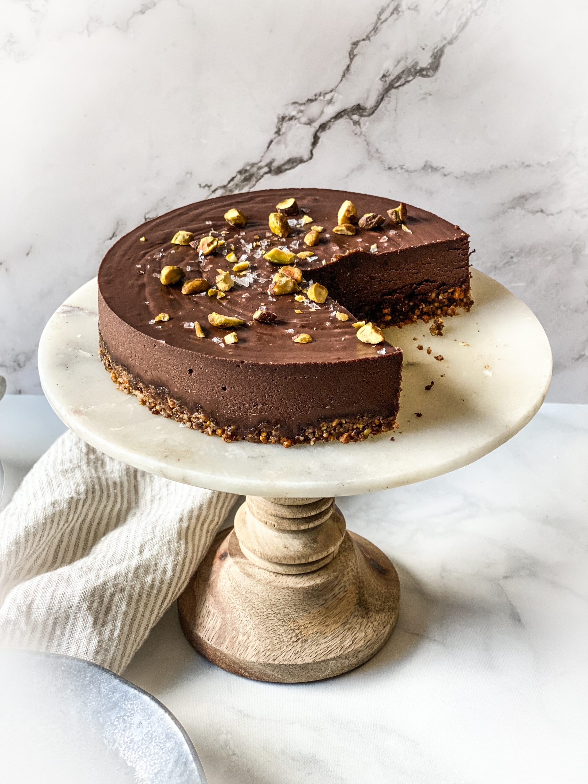 chocolate torte topped with pistachios and coarse sea salt