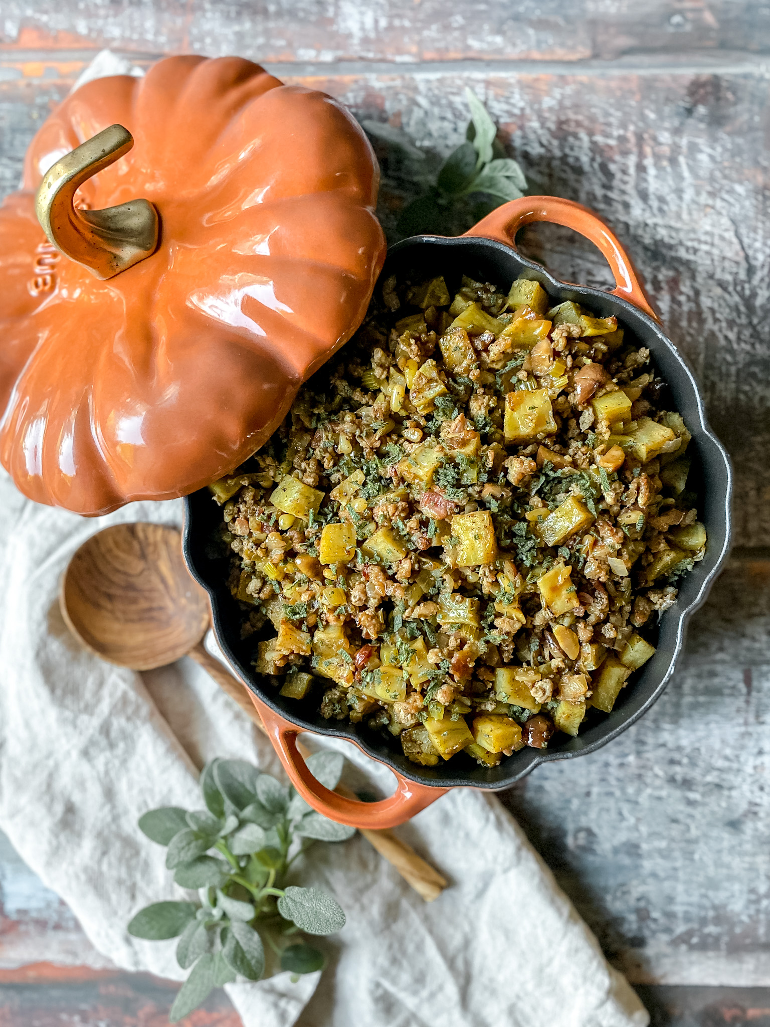 staub pumpkin cocotte filled with paleo stuffing