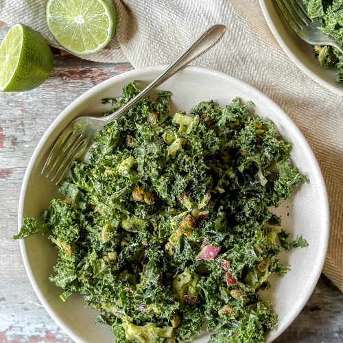 kale salad with tahini dressing, pistachios, avocado, dates and chicken