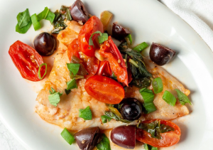 fish cooked with tomatoes and olives