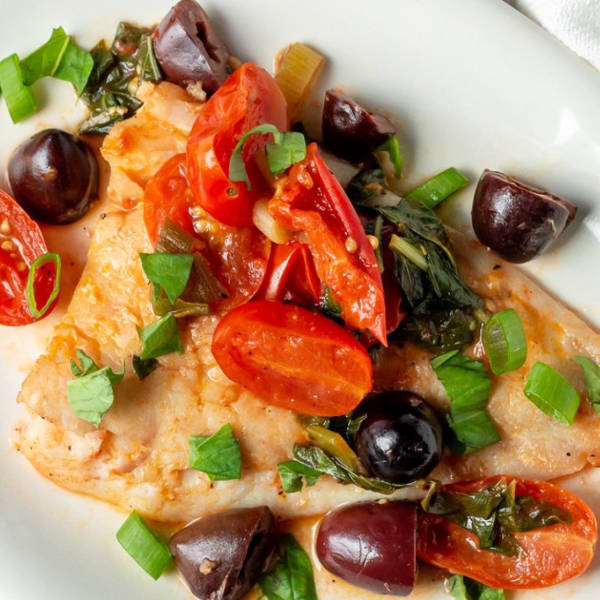 fish cooked with tomatoes and olives