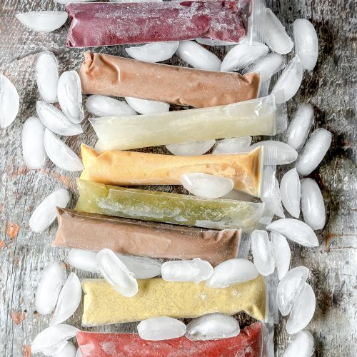 8 colorful ice pops on a bed of ice