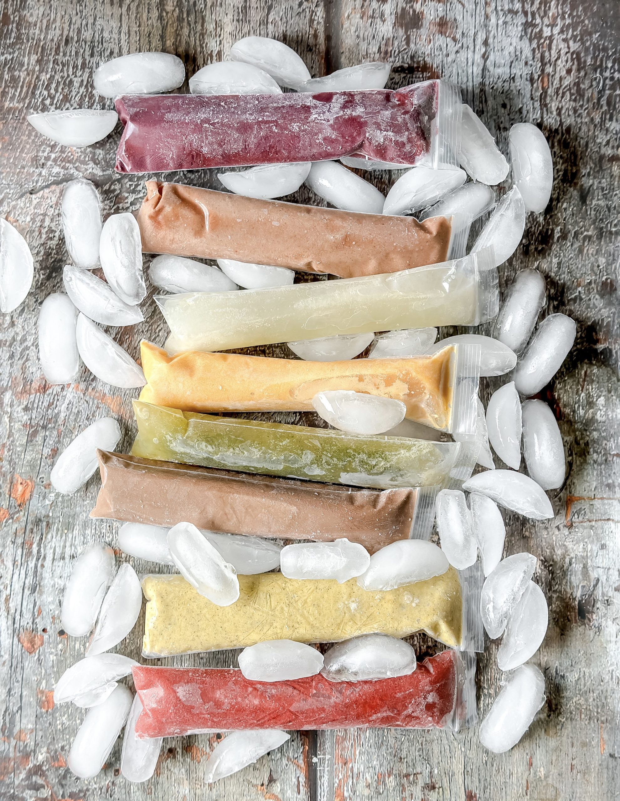 8 colorful ice pops on a bed of ice