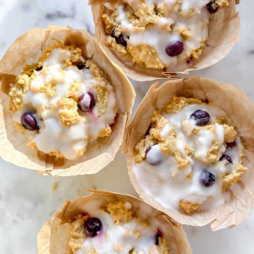 close up of lemon blueberry muffins with sugar free lemon glaze